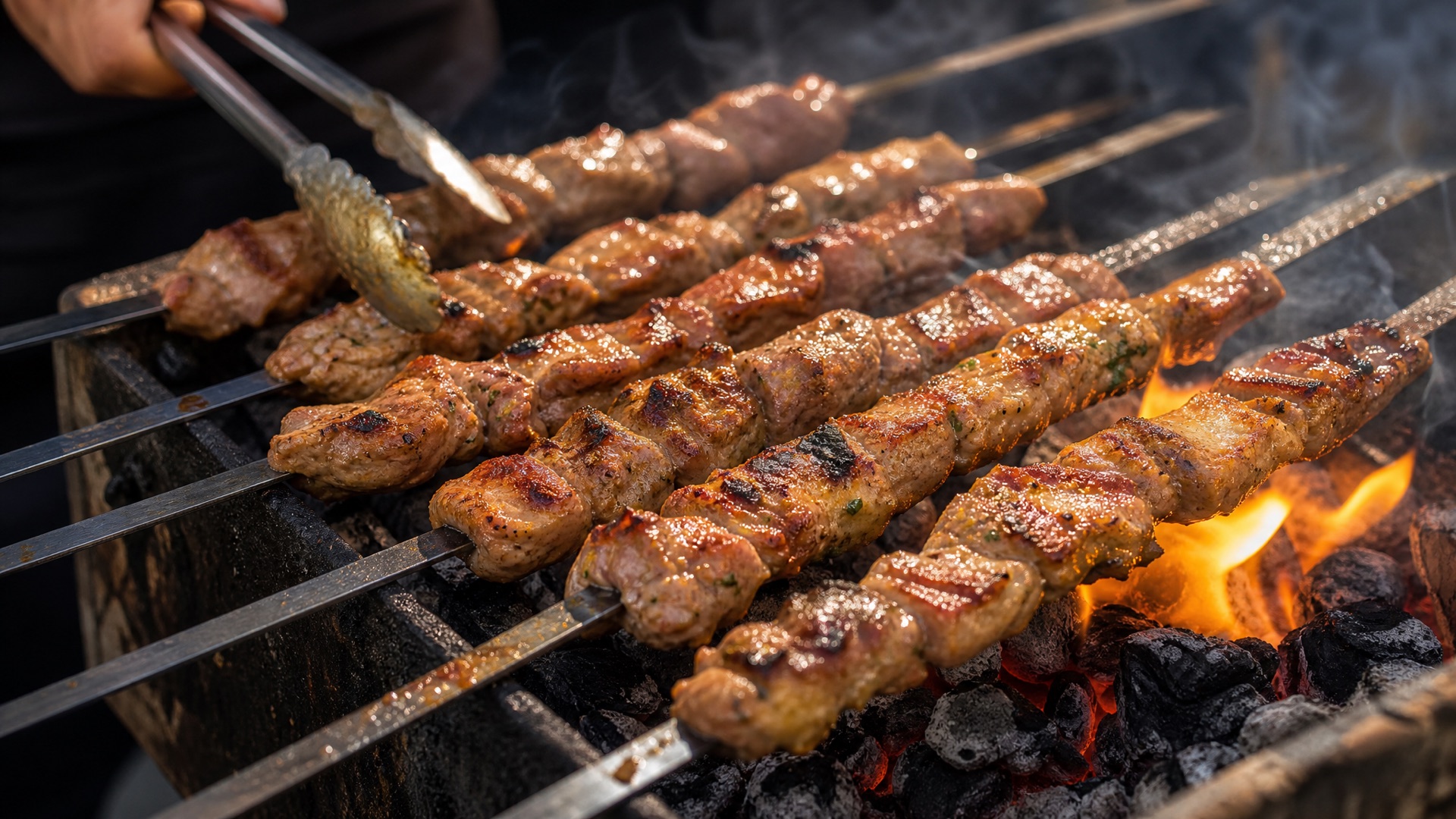 Skewers searing over glowing charcoal